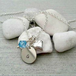 Cluster necklace with initial disc and charms